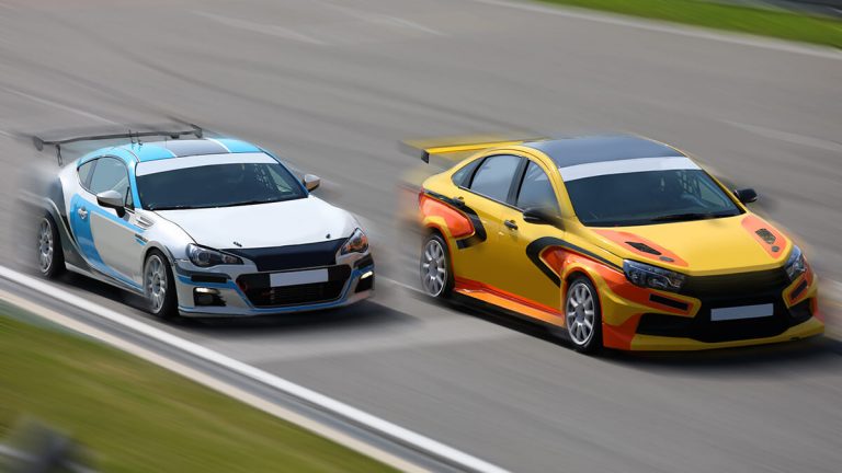 Two cars on race track