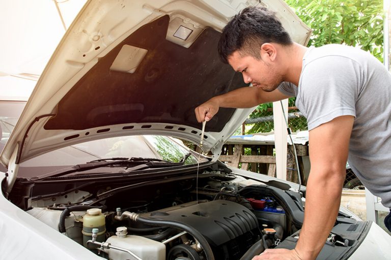 Man Checking Car At Home
