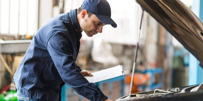 Mechanic Working On A Car